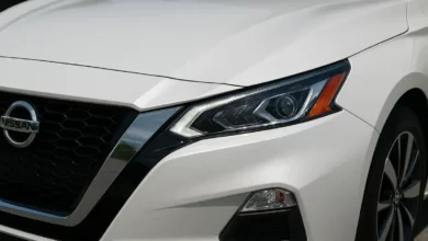 Nissan vehicle front headlight detail.