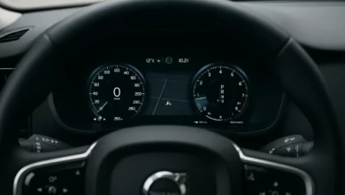 The image shows a close-up view of a vehicle's dashboard featuring a sophisticated digital instrument cluster.