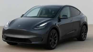 The image displays a digital interface featuring a modern electric vehicle, depicted in a sleek, dark color against a light…
