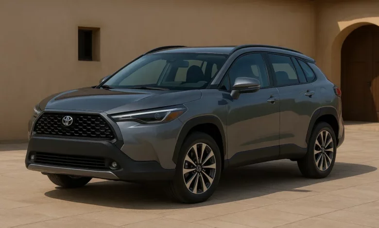The image features two modern crossover vehicles, positioned on a paved terrace in front of a traditional stucco building.
