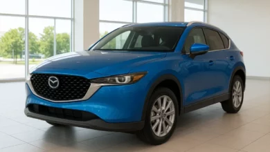 The image depicts a bright, modern car dealership interior featuring a shiny blue vehicle prominently in the foreground.